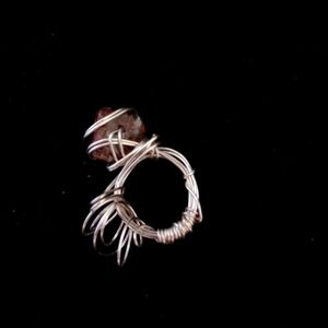 Wire-wrapped red and brown stone ring